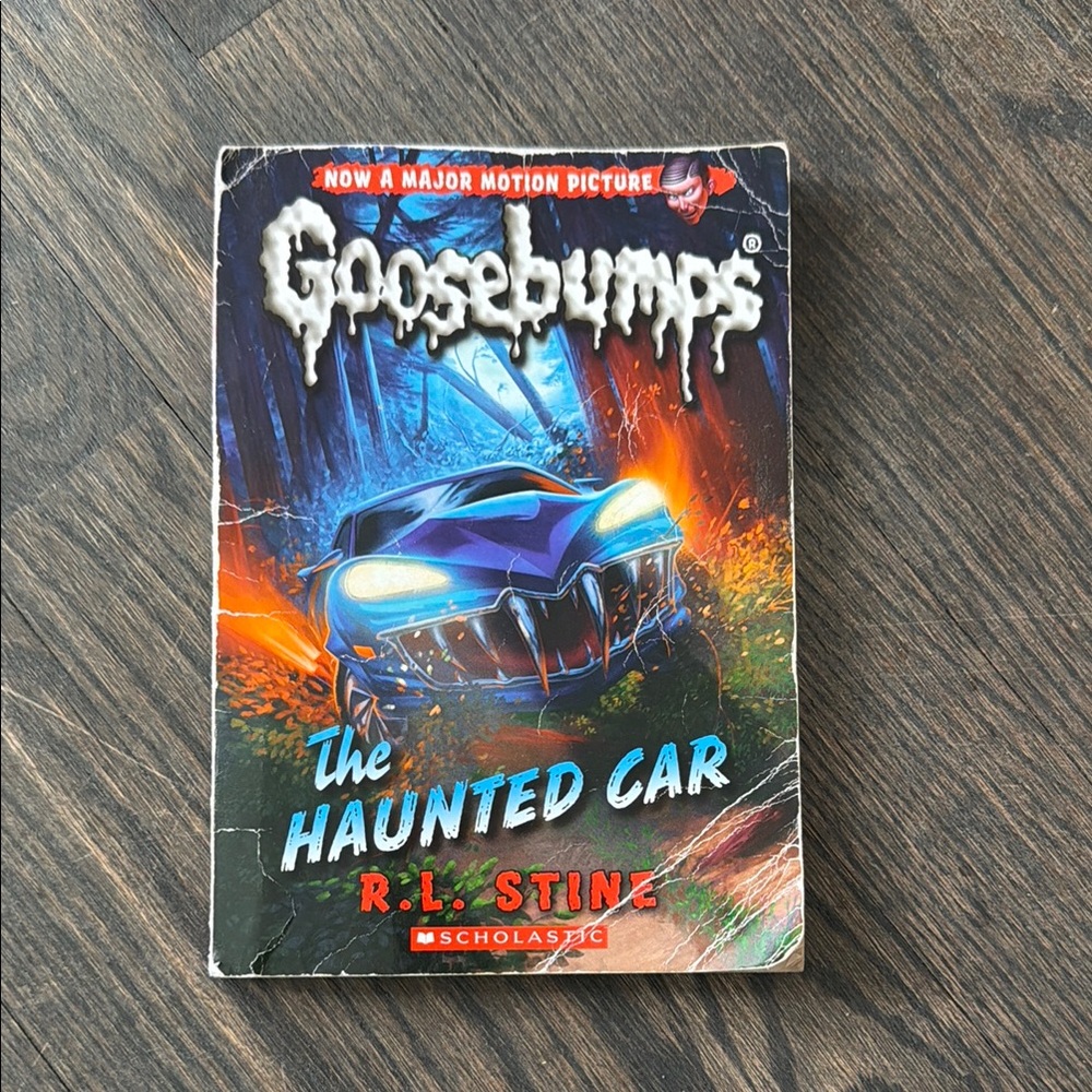 Scholastic Goosebumps: The Haunted Car with Blue and Orange Cover